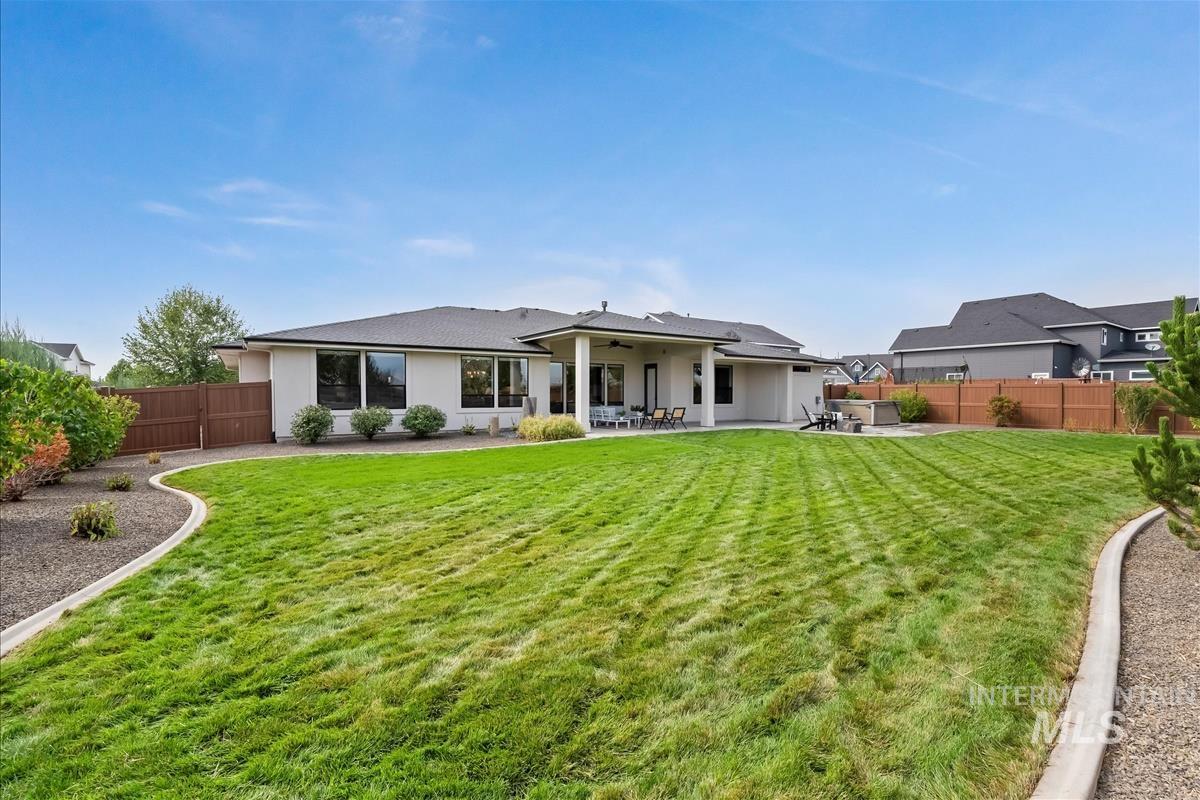 Back of property featuring a patio area, a fenced backyard, and stucco siding
