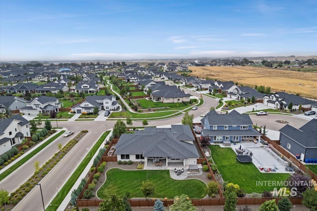 Aerial overview of property's location featuring nearby suburban area
