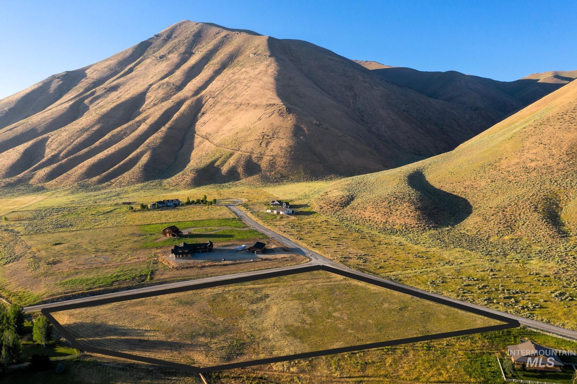 View of mountain background featuring rural landscape