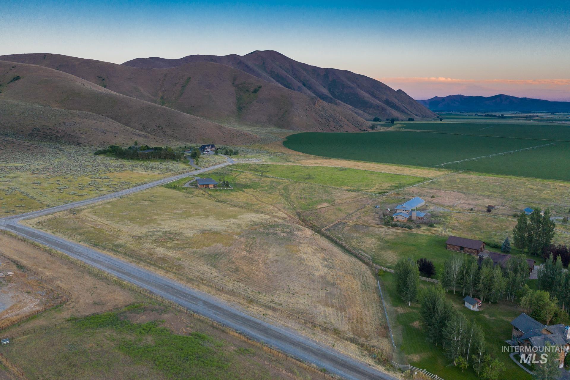 View of mountain background featuring rural landscape
