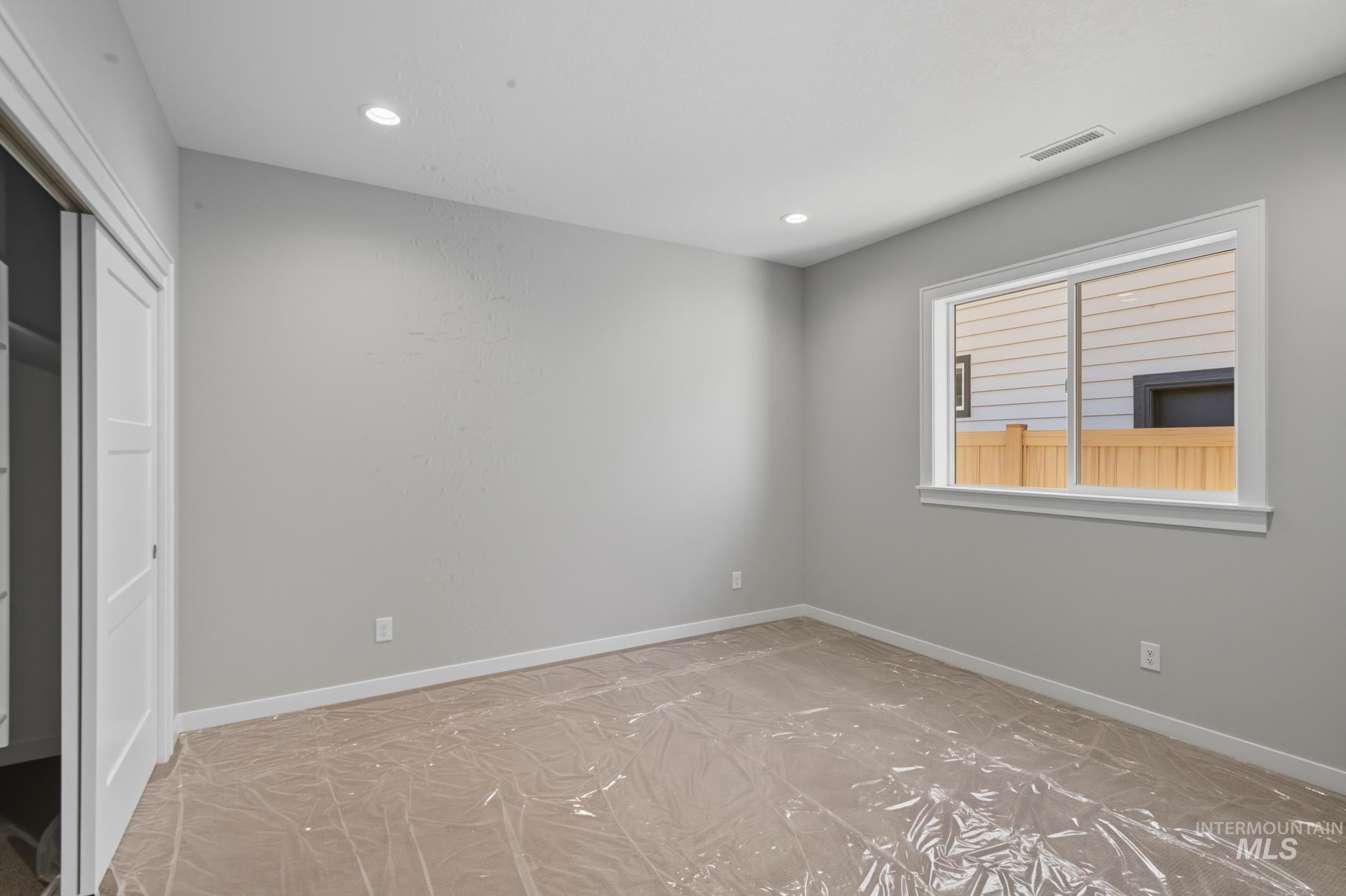 Unfurnished bedroom featuring recessed lighting and a closet
