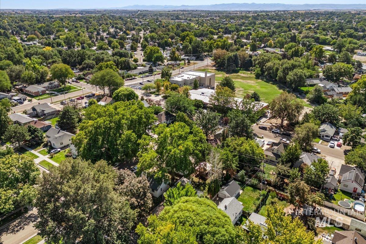 Aerial perspective of suburban area with a tree filled landscape