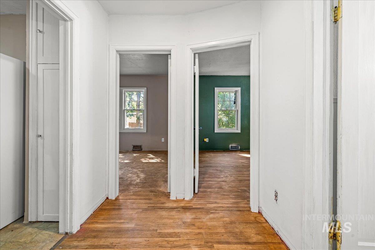 Hallway featuring wood finished floors