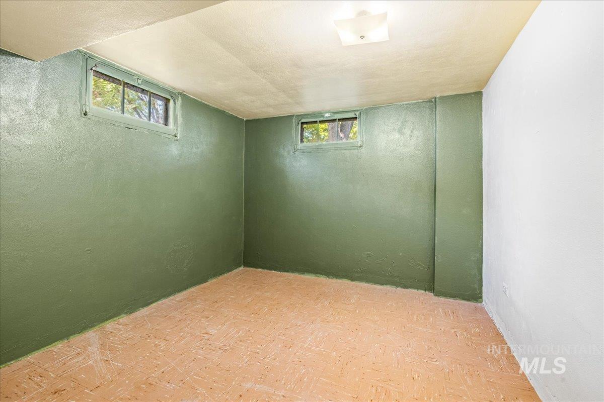 Basement featuring a textured ceiling