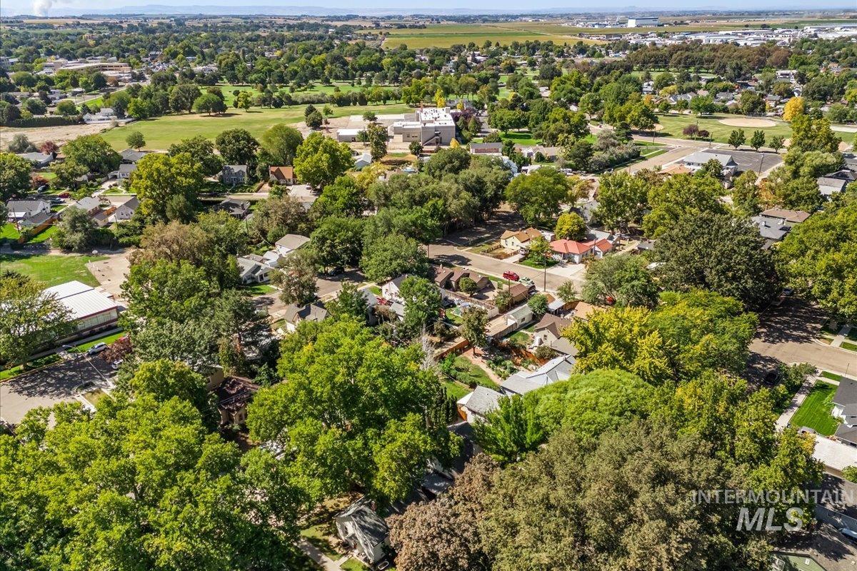 Aerial perspective of suburban area featuring a tree filled landscape
