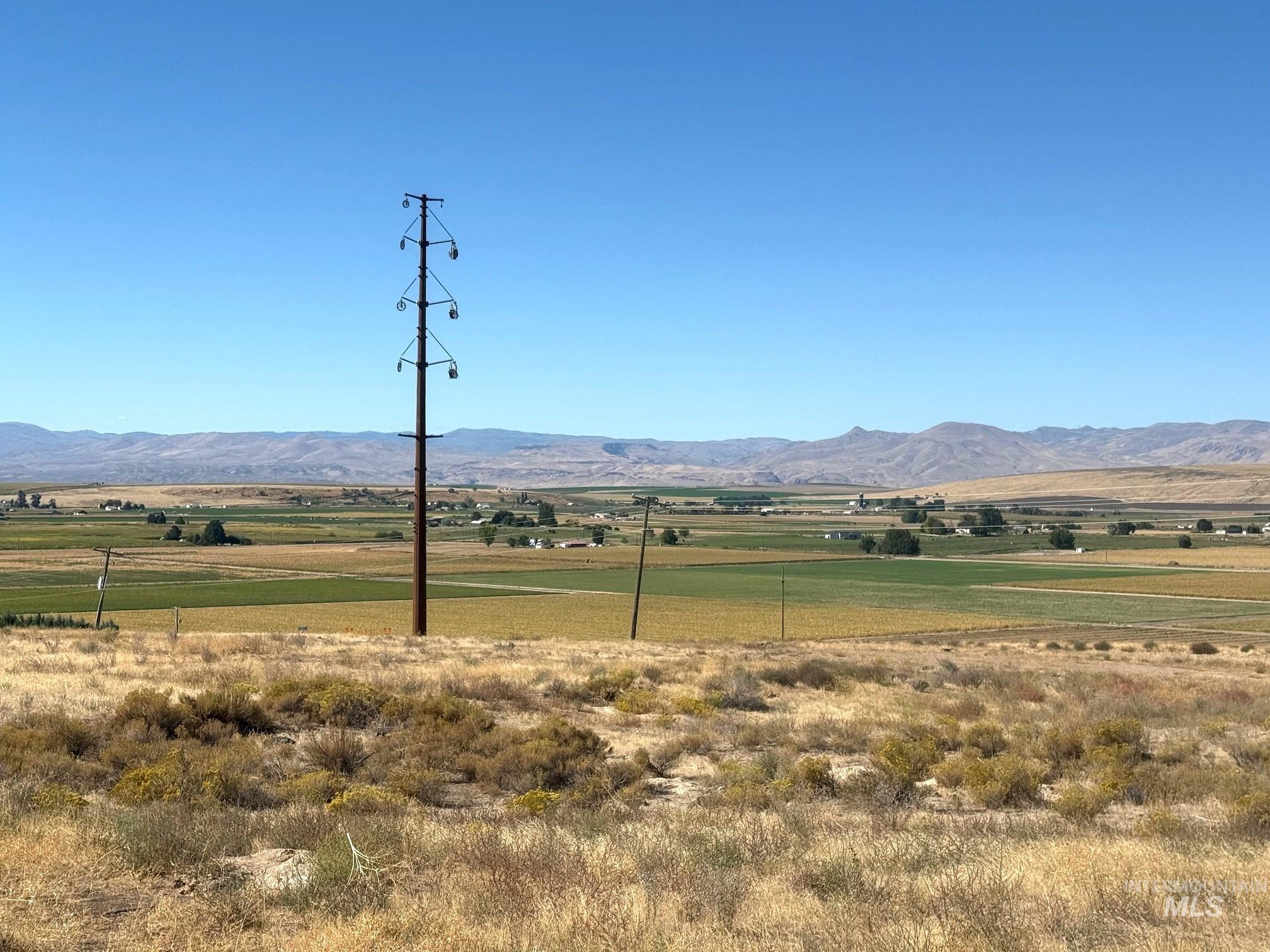 View of mountain background featuring rural landscape