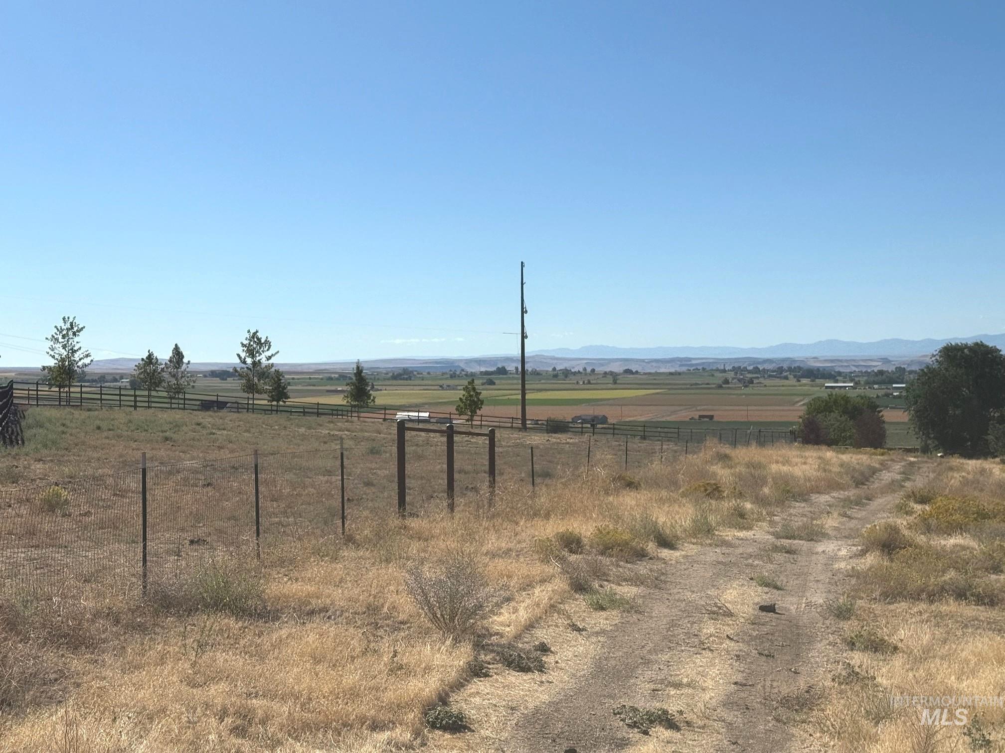 View of yard featuring a view of countryside and a mountain view