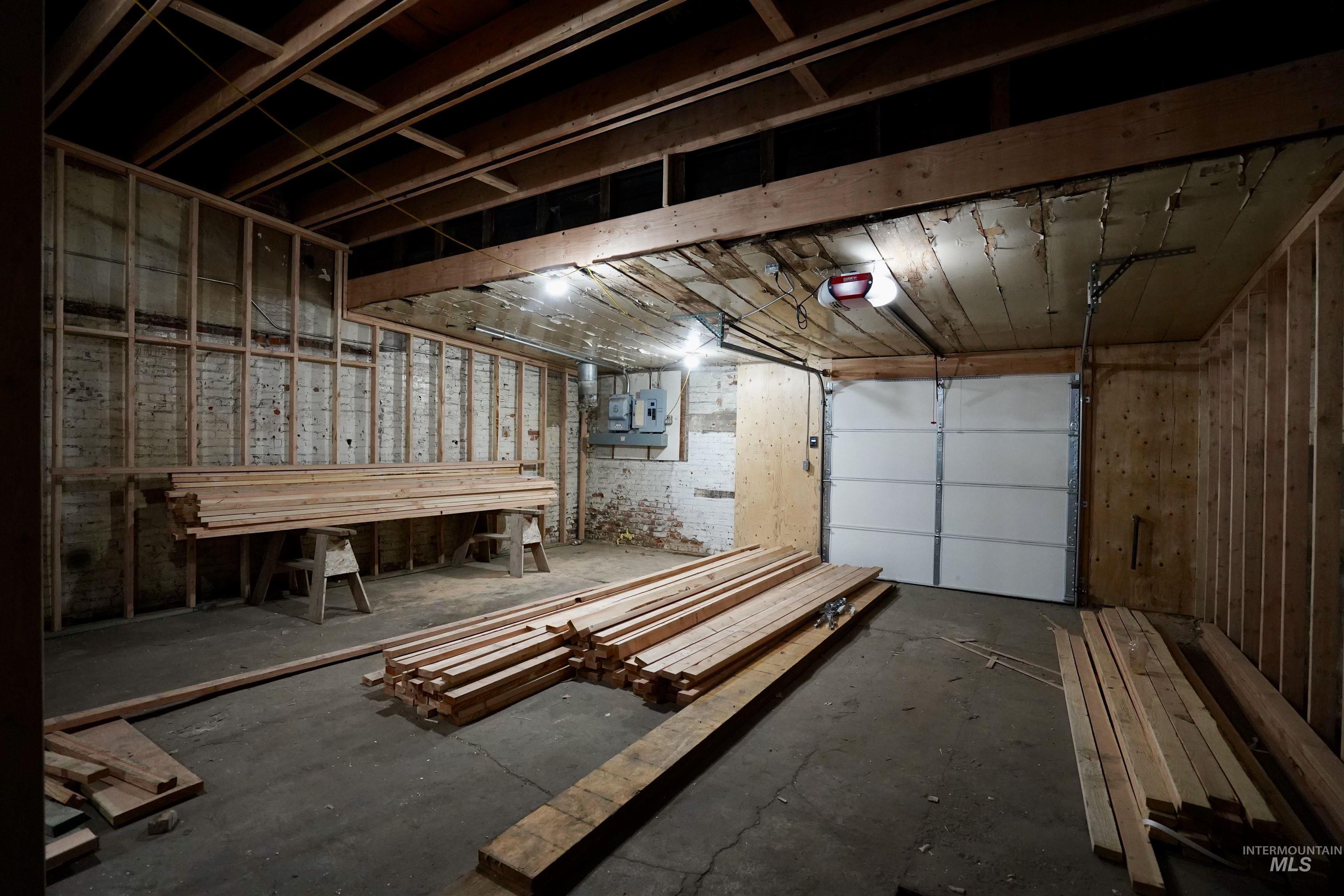 Garage with a garage door opener and electric panel