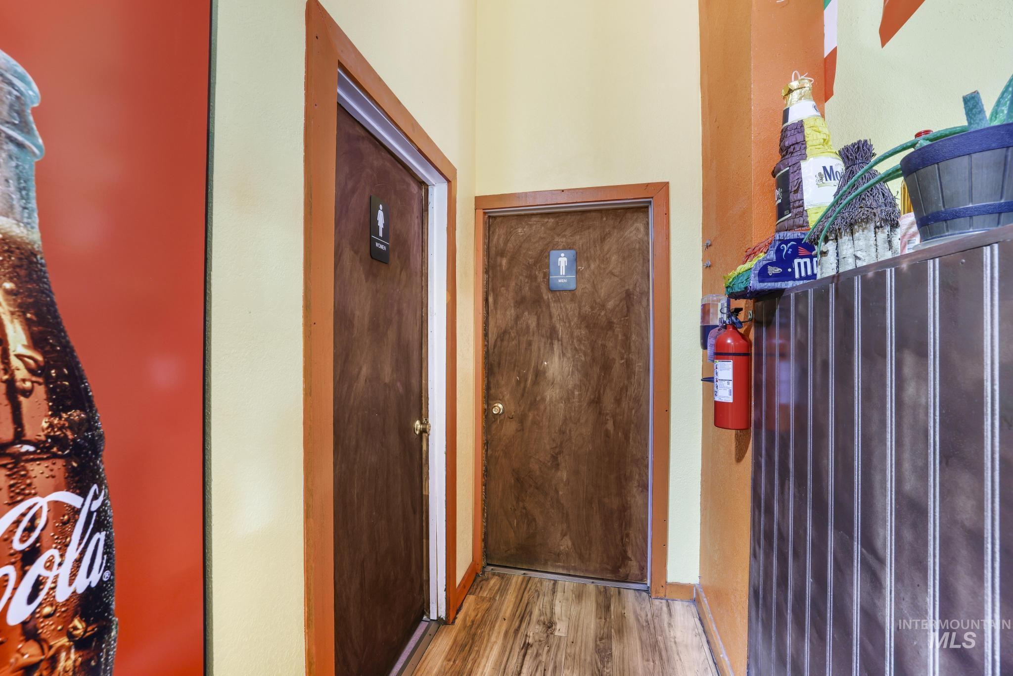 Foyer with wood finished floors and baseboards