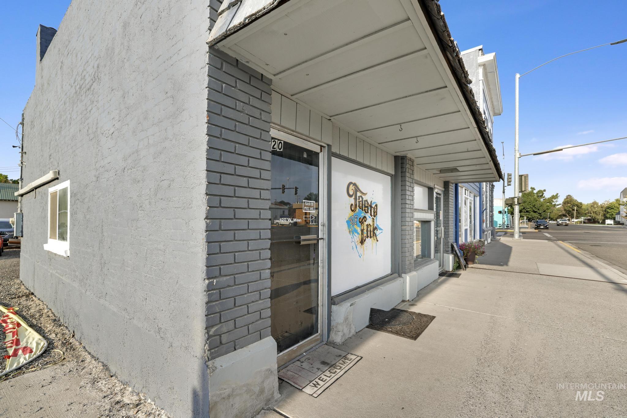 Entrance to property with brick siding