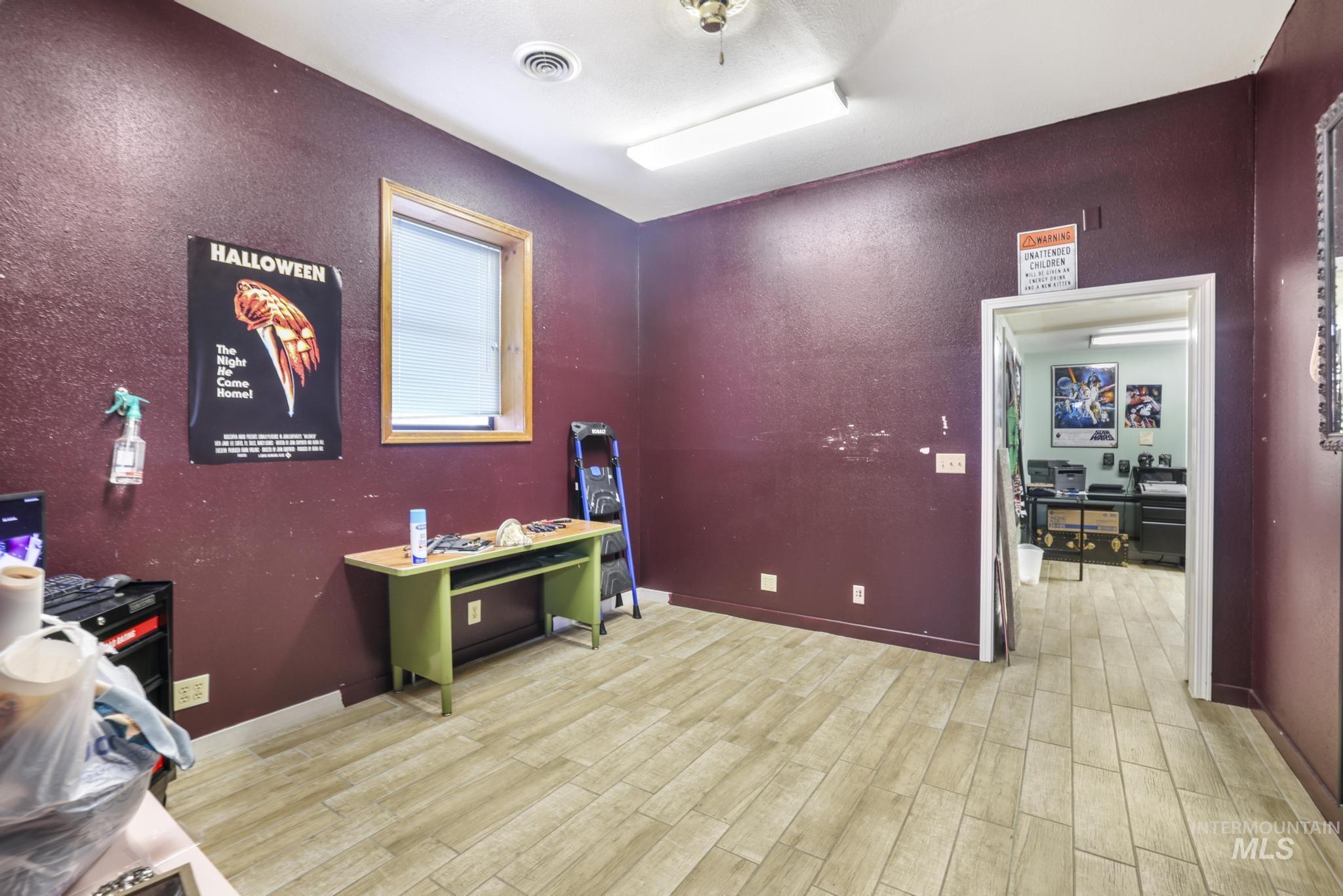 Office featuring light wood-type flooring and baseboards