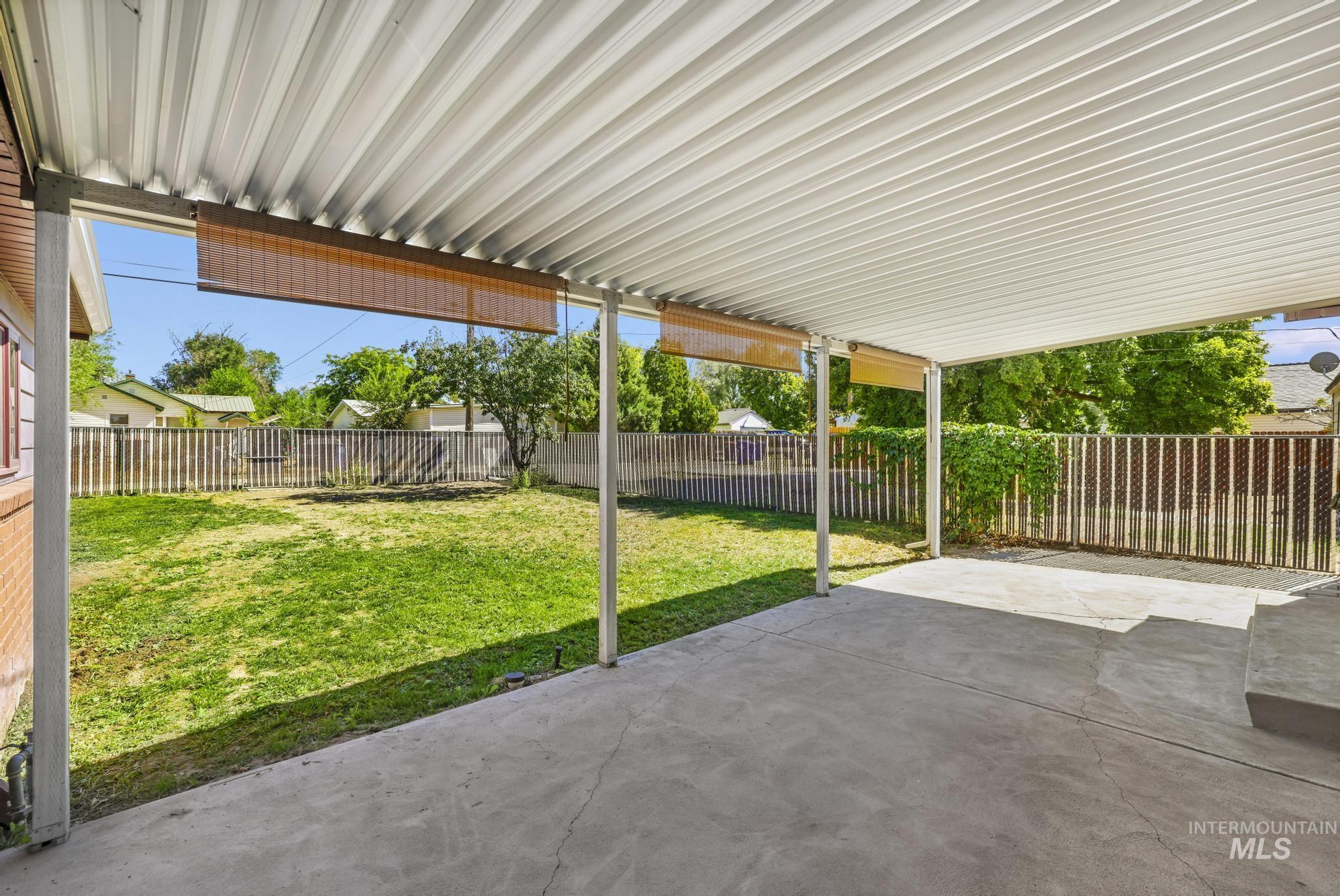 Fenced backyard featuring a patio area