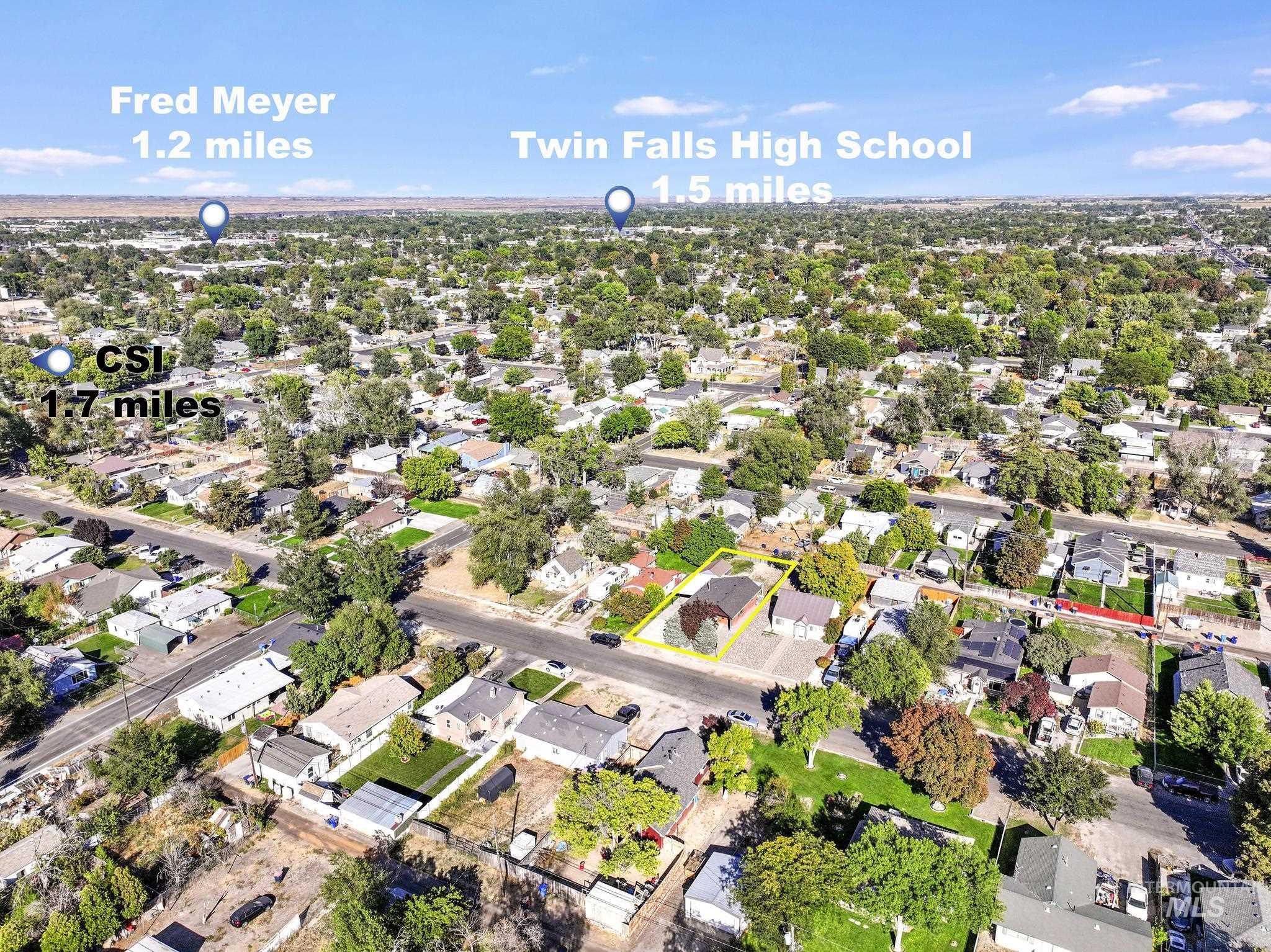 Aerial overview of property's location featuring nearby suburban area