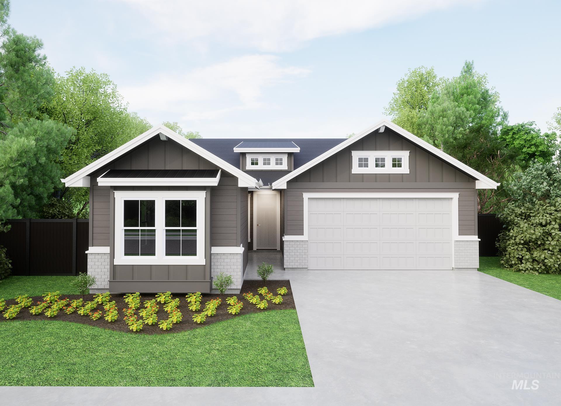 Craftsman-style home featuring board and batten siding, driveway, and brick siding