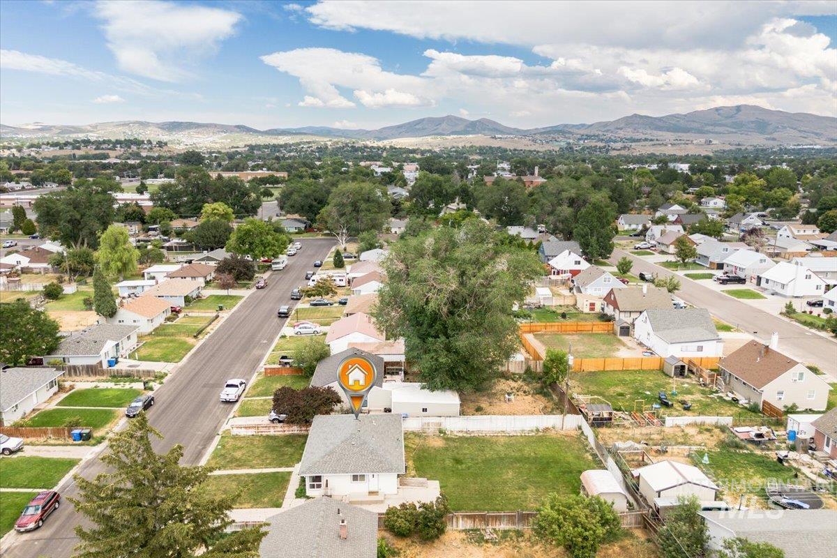 Aerial view of residential area featuring a mountain backdrop