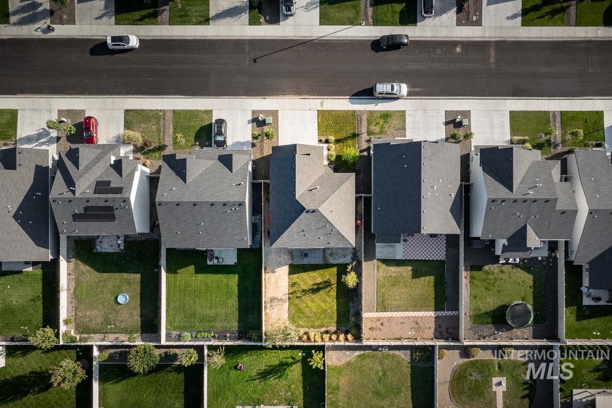 Aerial view of property's location featuring nearby suburban area