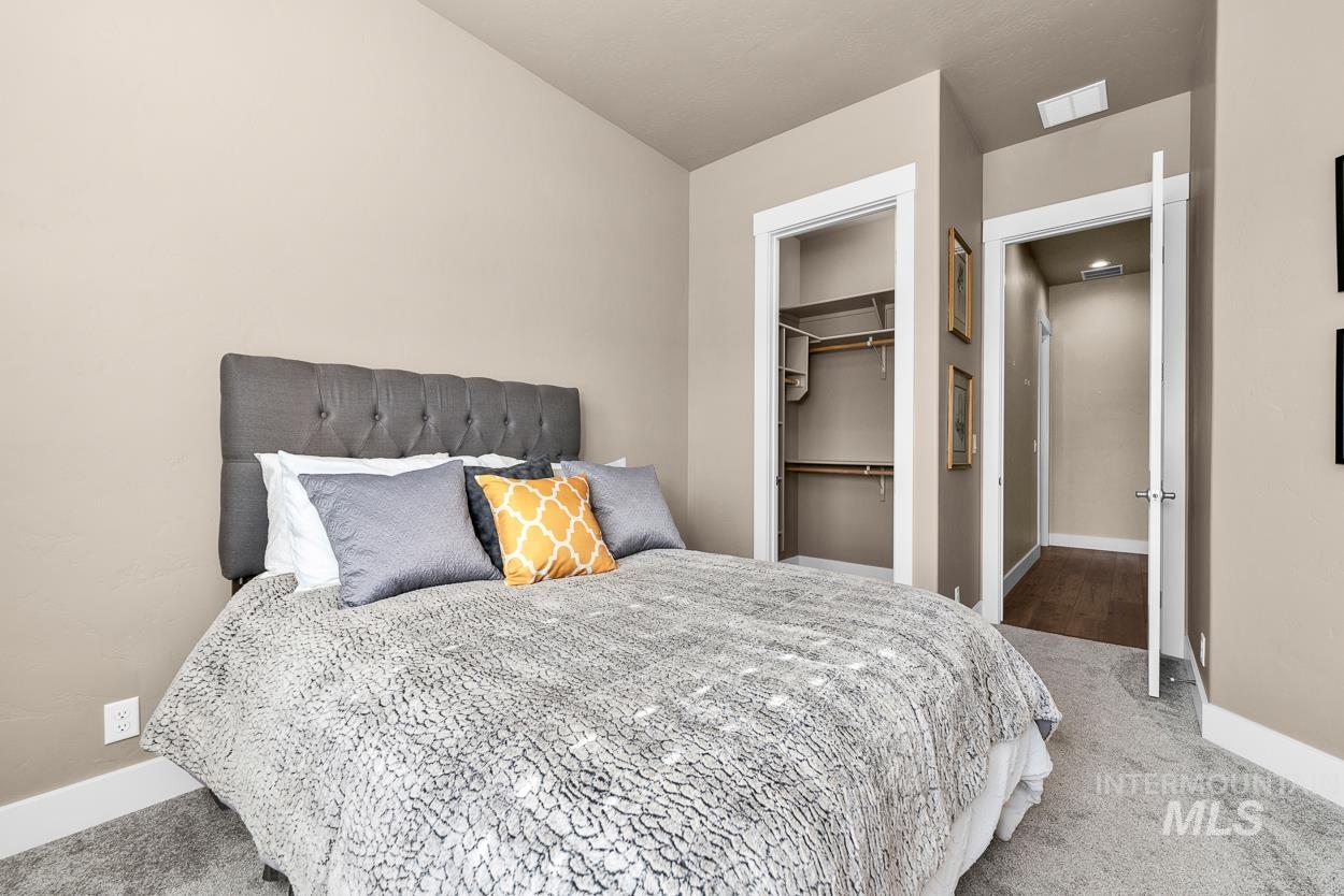 Bedroom with carpet flooring and a closet