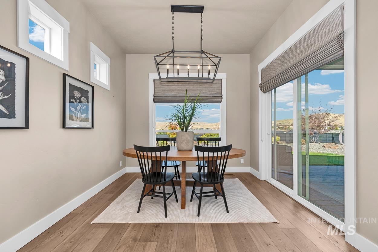 Dining area featuring wood finished floors