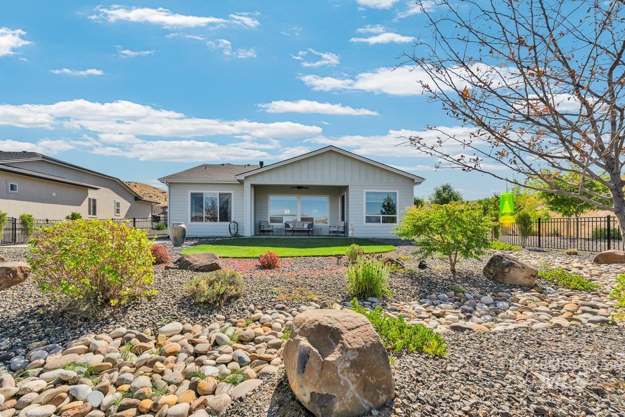 Back of house with a patio, ceiling fan, and outdoor lounge area