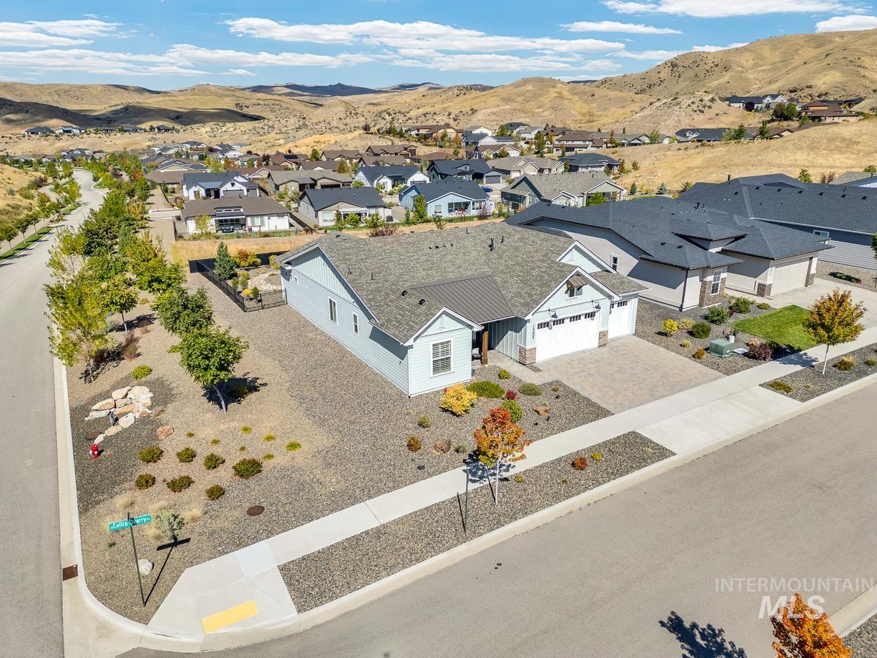 Aerial view of residential area featuring a mountain backdrop
