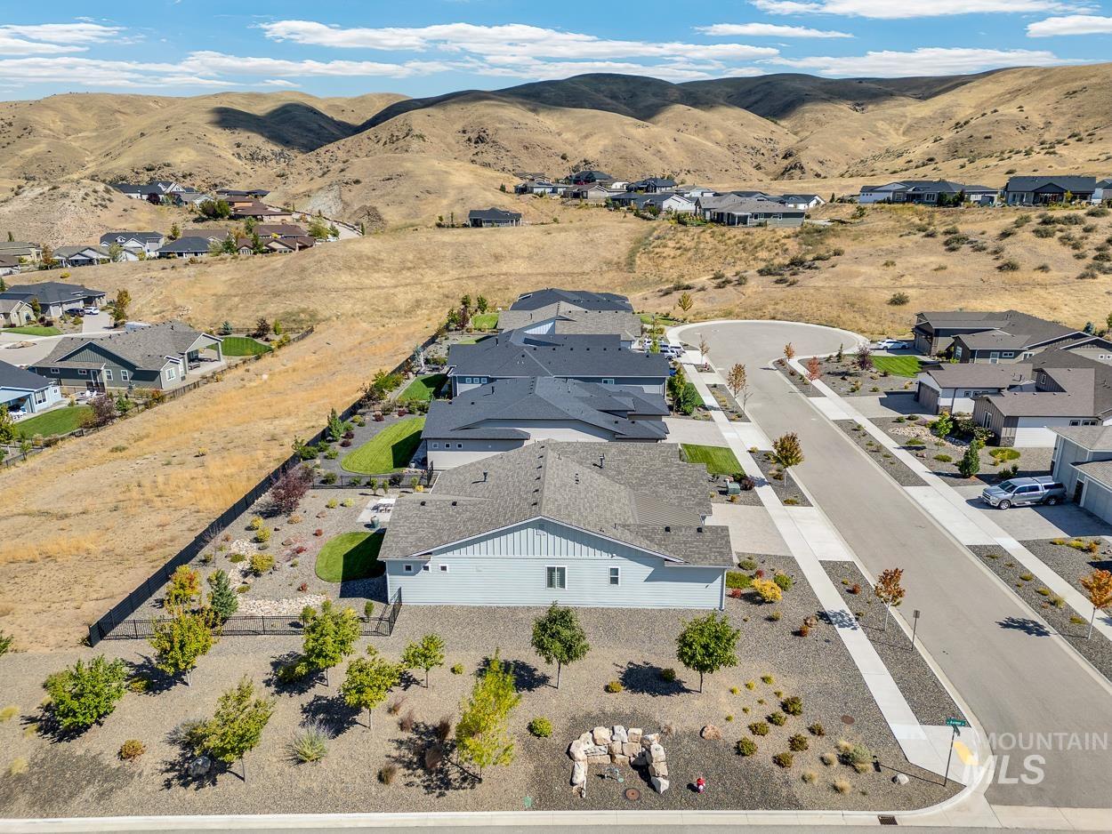 Aerial perspective of suburban area featuring a mountainous background