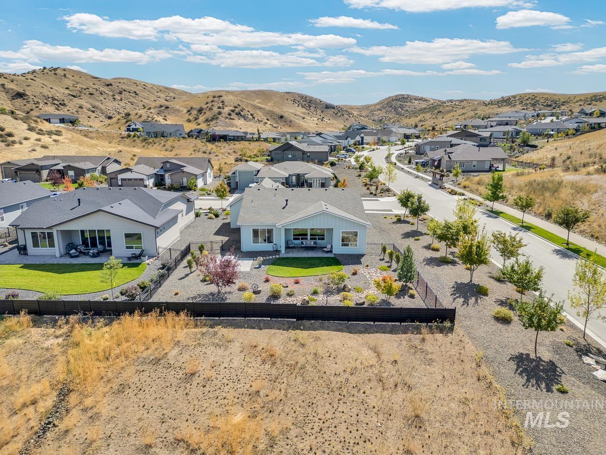 Aerial view of residential area featuring a mountain backdrop