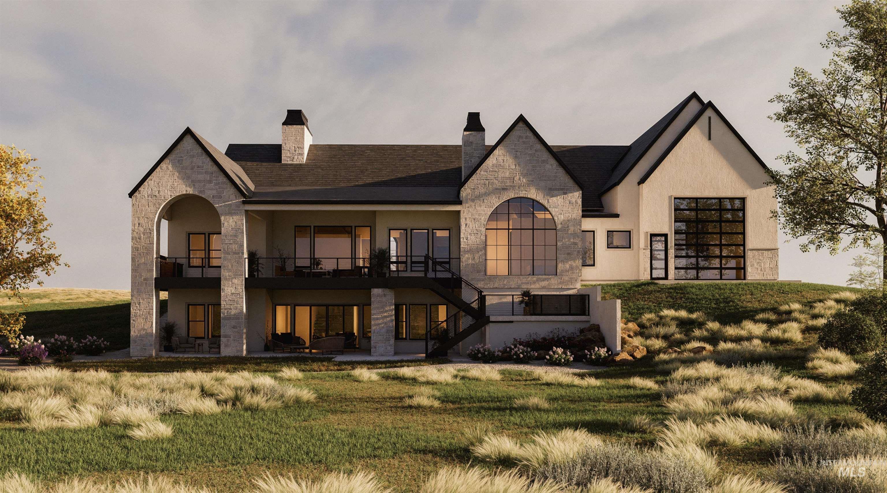 Back of property with stone siding, a chimney, a yard, and stucco siding