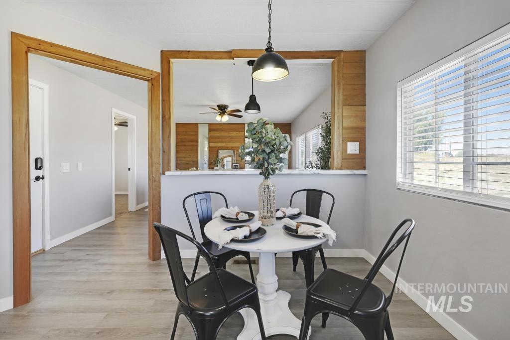 Dining area featuring wood finished floors and baseboards