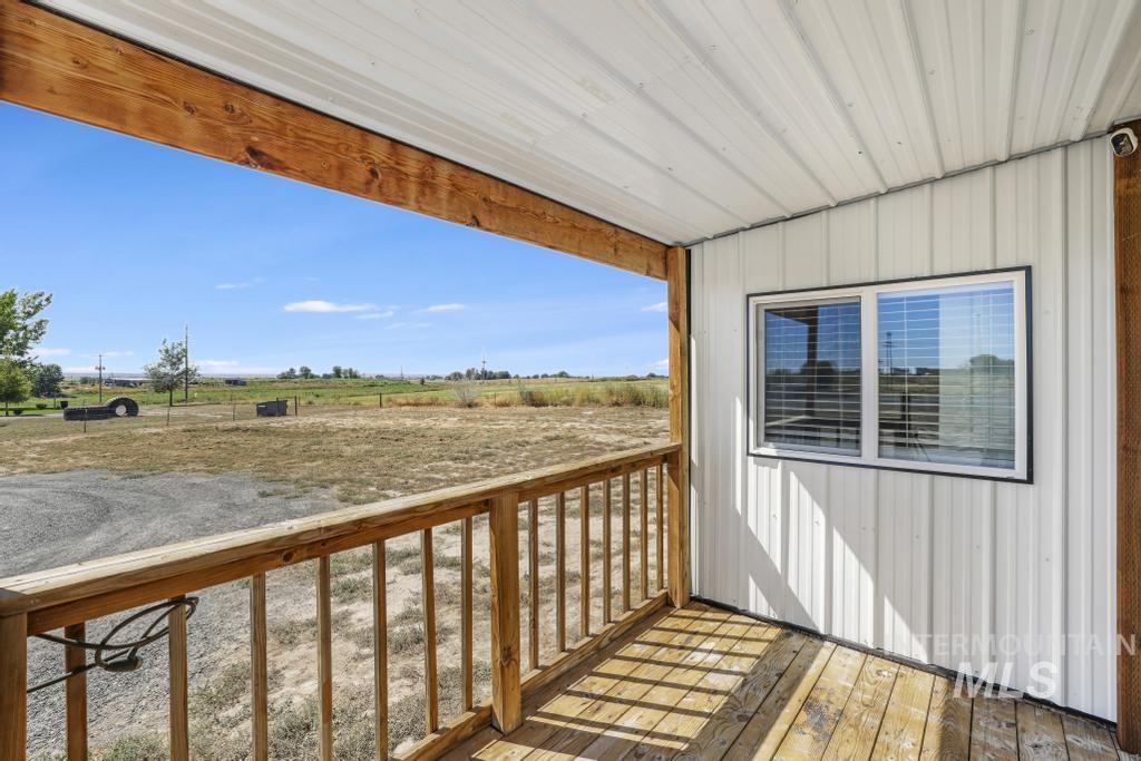Wooden deck featuring a view of rural / pastoral area