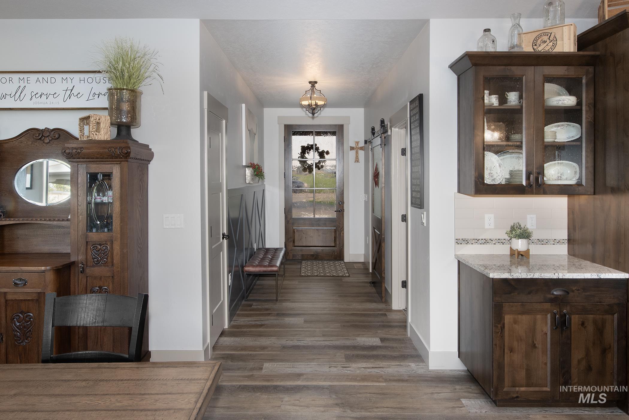 Entryway with dark wood-style floors