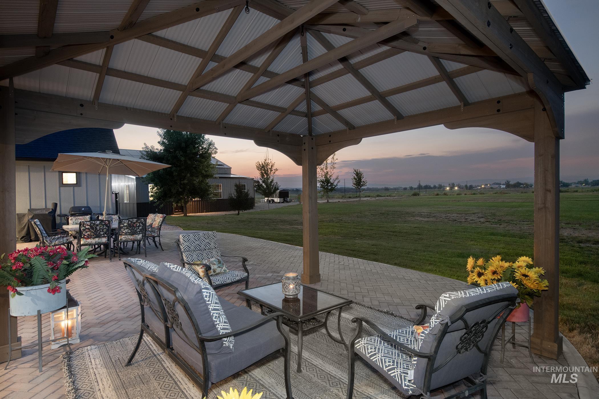 View of patio featuring outdoor lounge area, outdoor dining area, and a gazebo