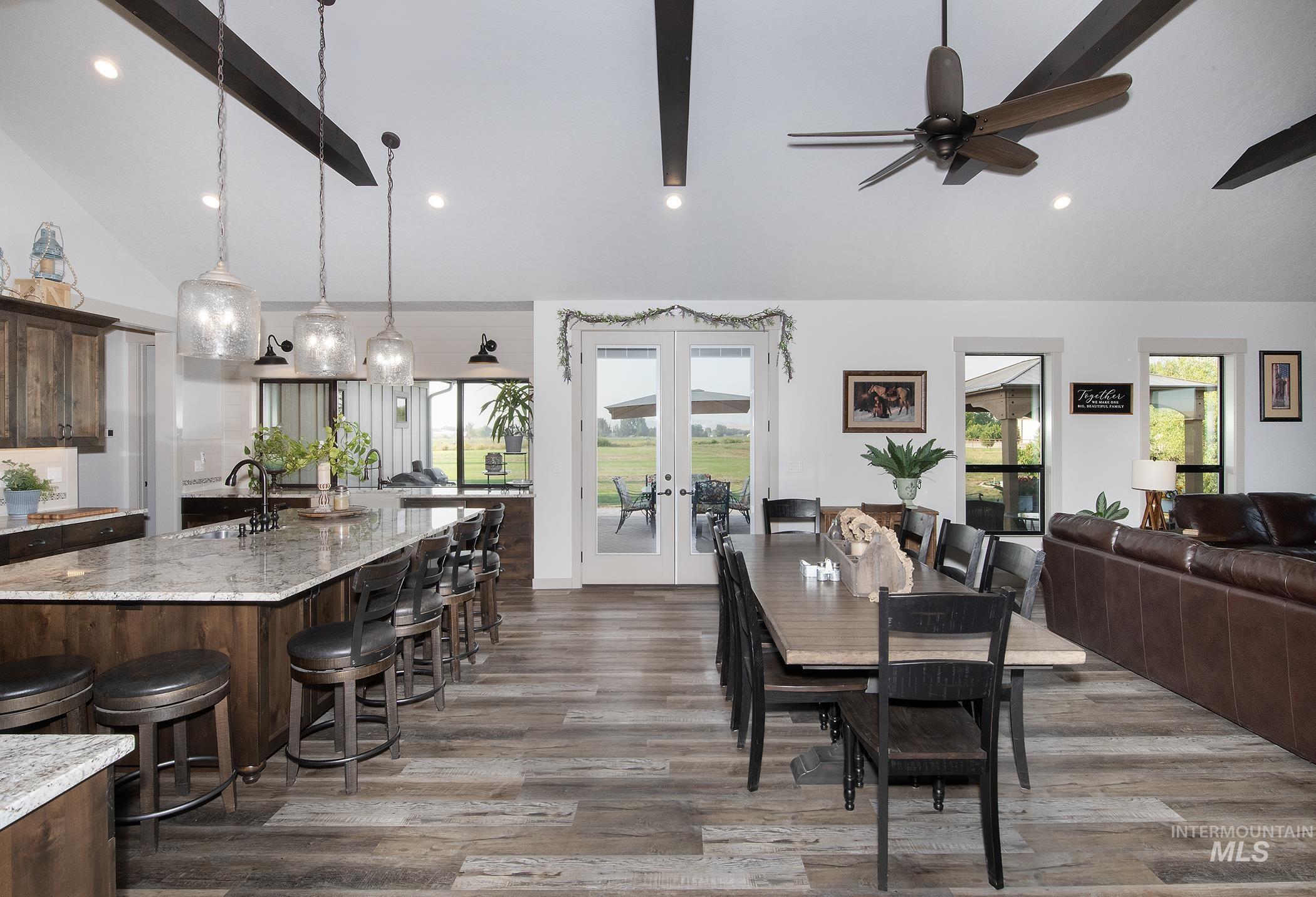 Dining room featuring french doors, dark wood finished floors, and recessed lighting