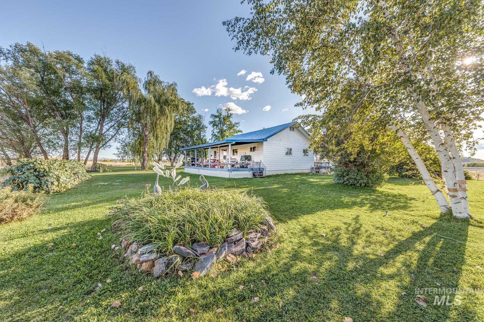 View of green lawn with a deck