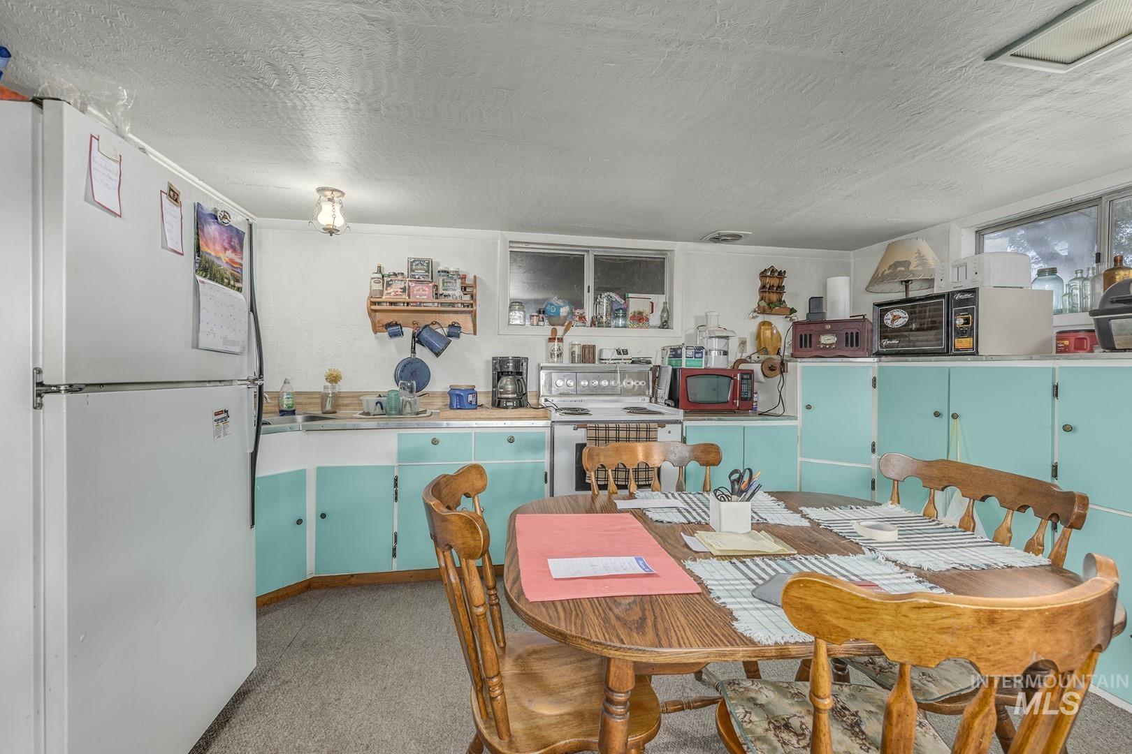 Dining space with a textured ceiling