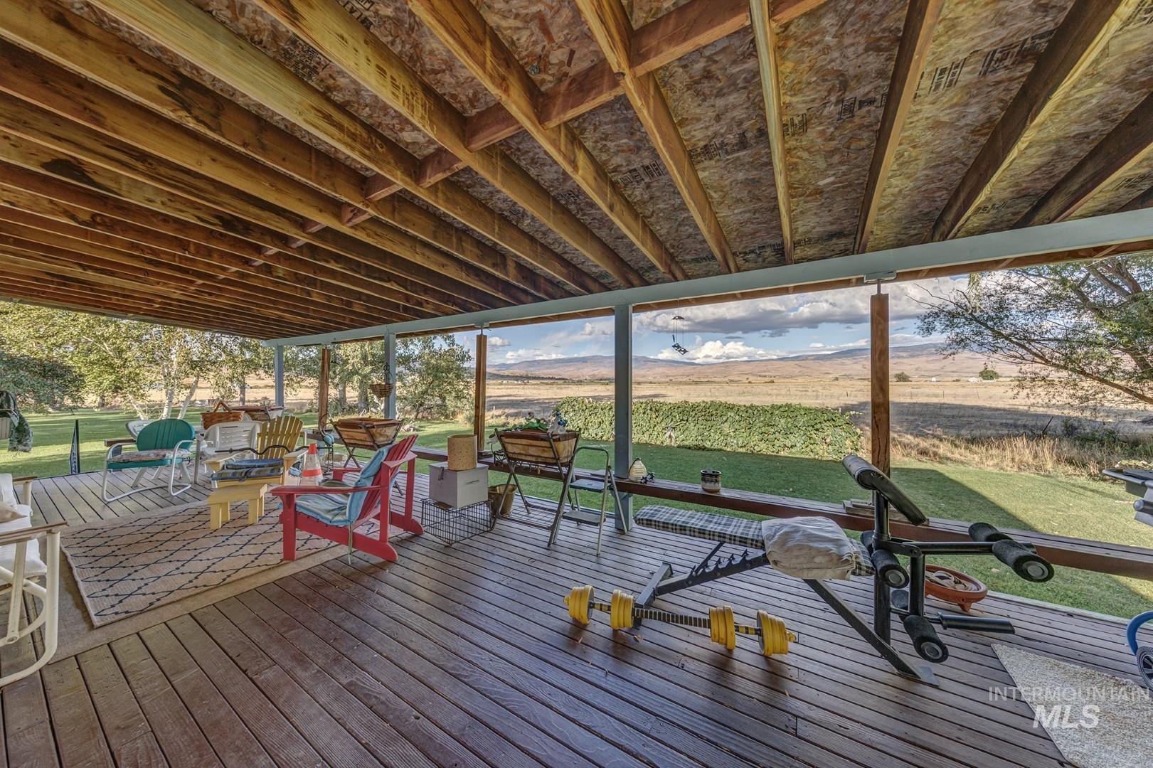 Deck featuring a lawn