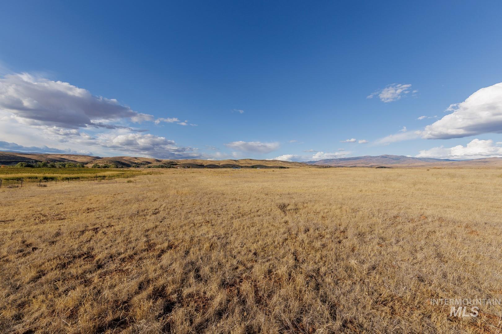 View of yard featuring a view of countryside and a mountain view