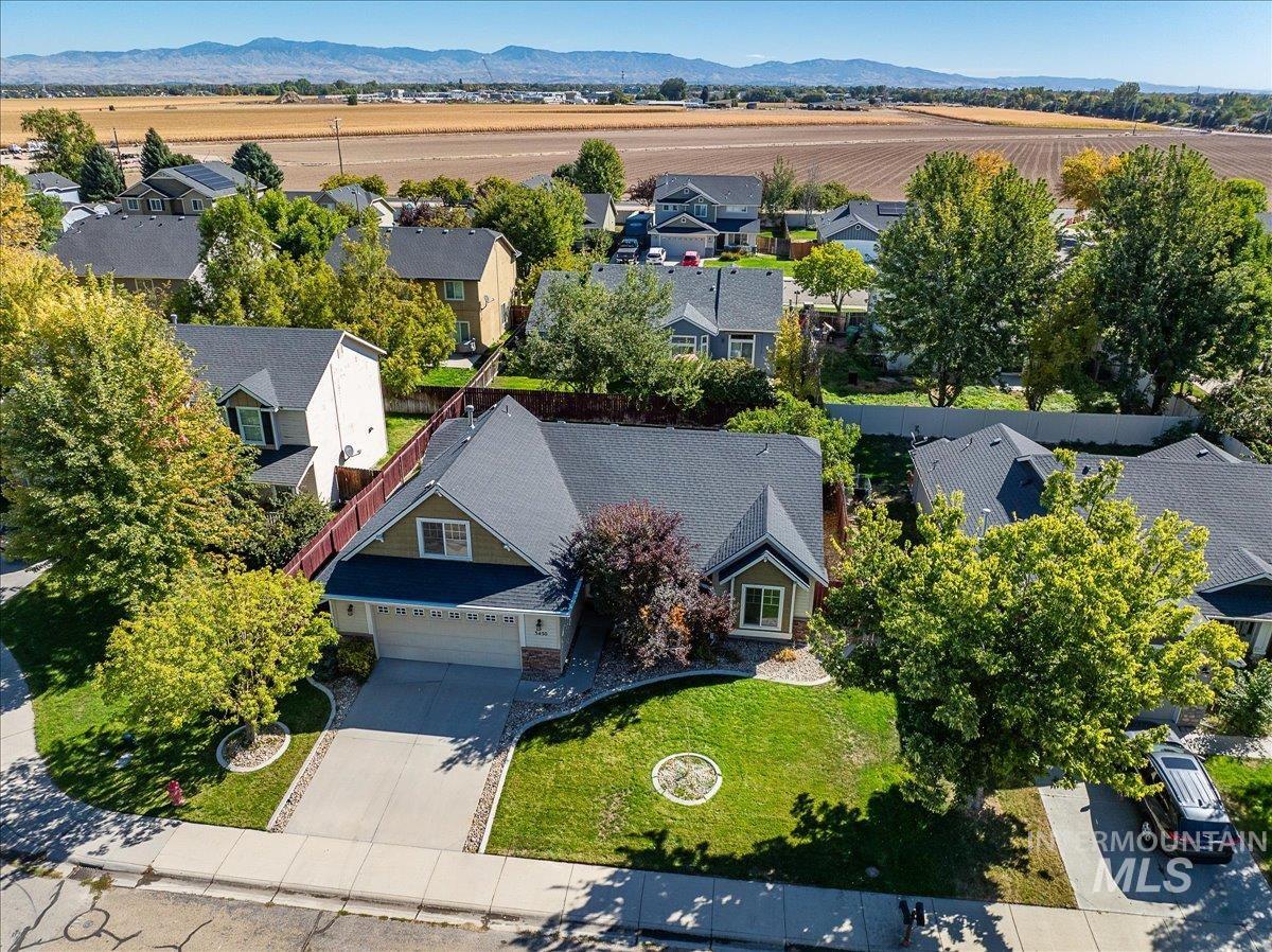 Aerial view of residential area with a mountainous background