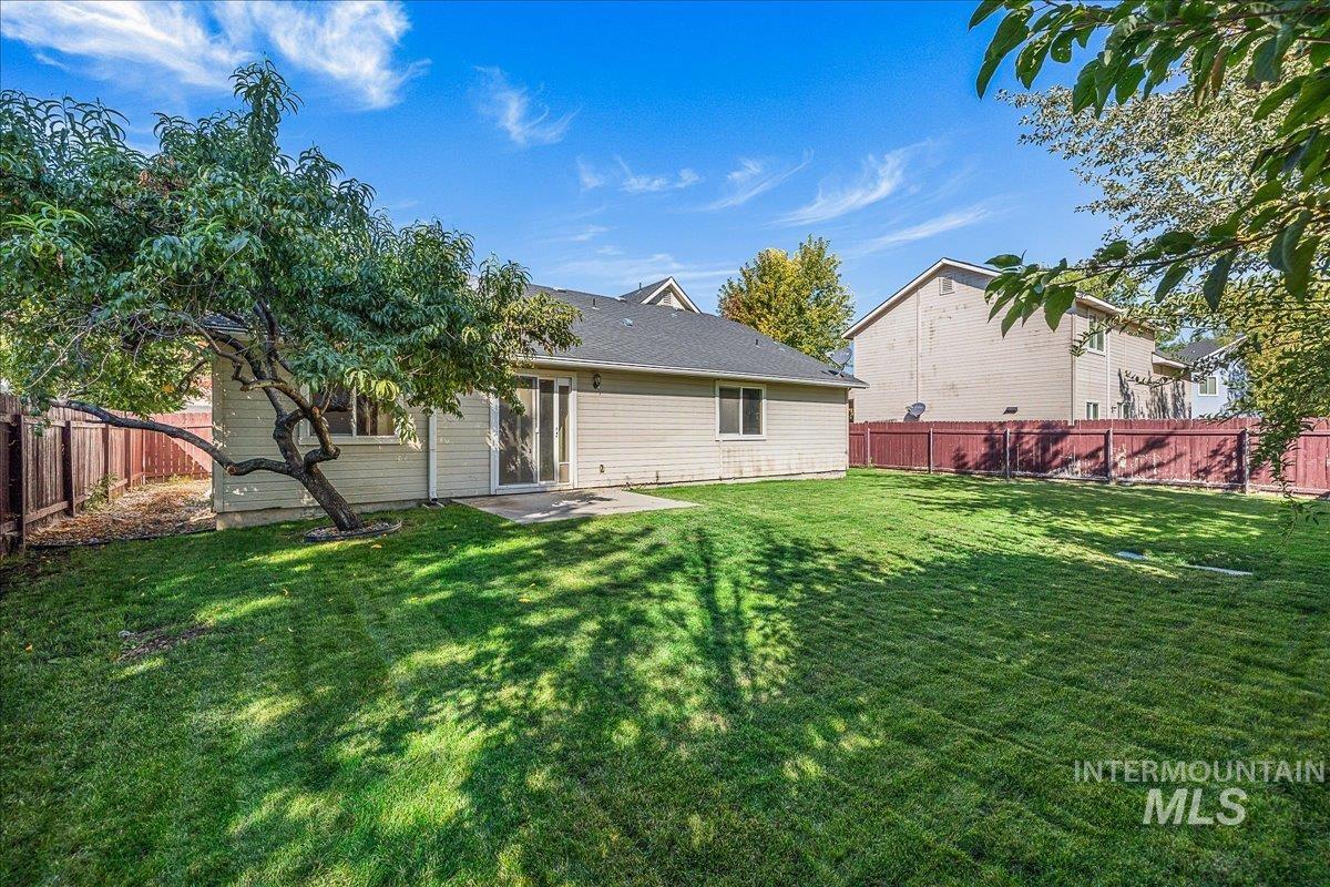 Back of house featuring a patio and a fenced backyard