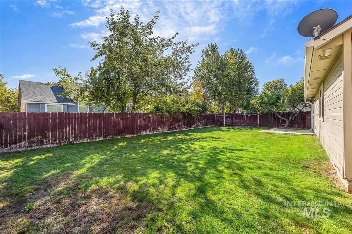 View of fenced backyard