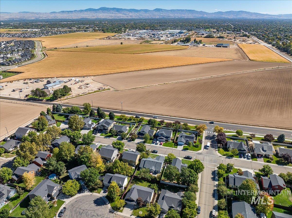 Aerial view of property's location with nearby suburban area