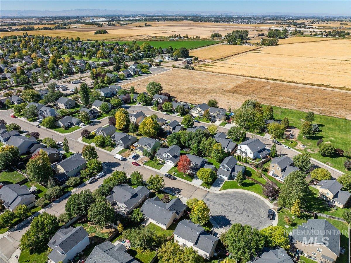 Aerial overview of property's location with nearby suburban area