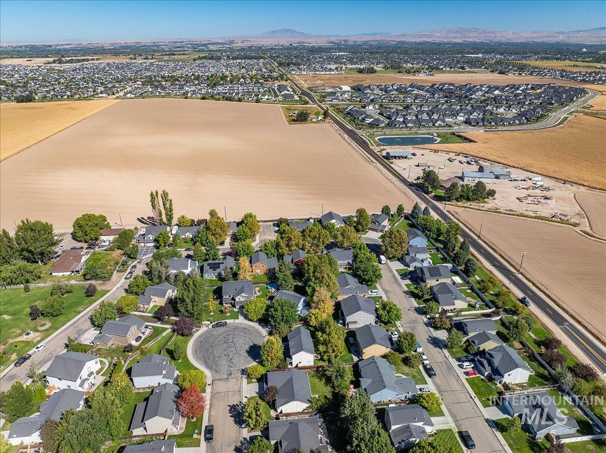 View of property location with nearby suburban area