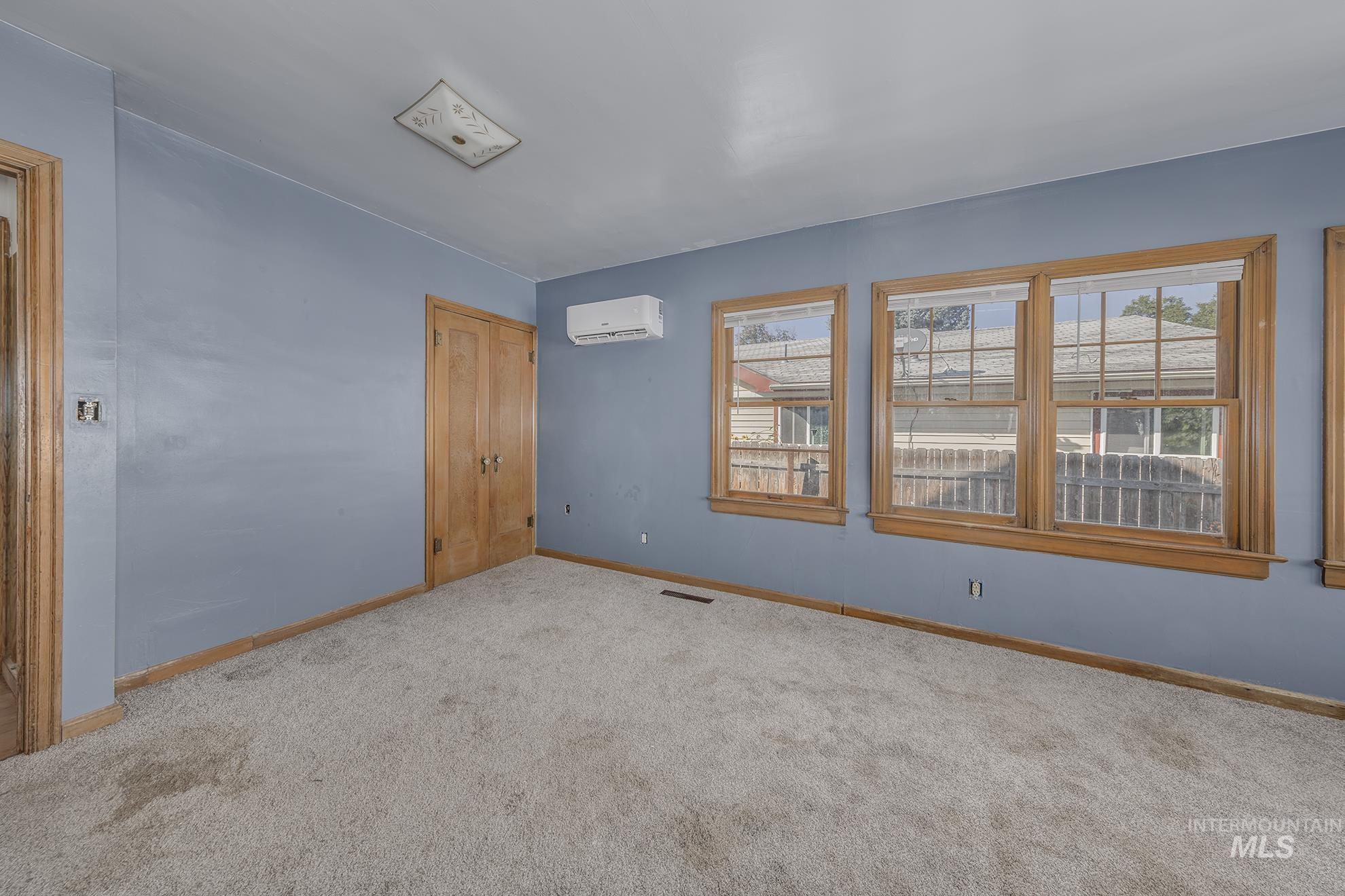Unfurnished bedroom featuring carpet and a closet