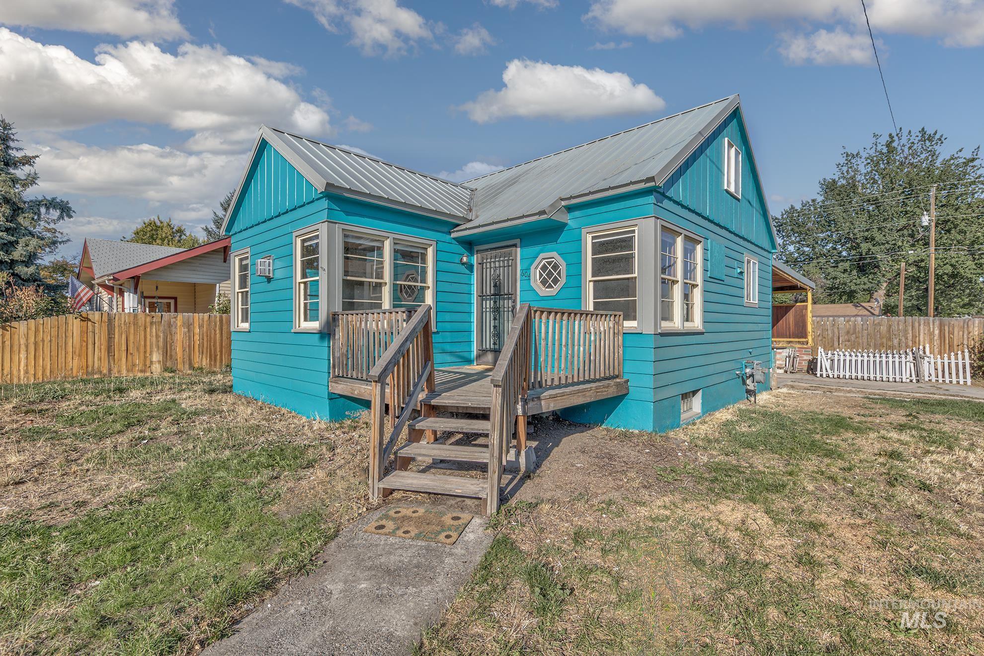 Bungalow-style home featuring a metal roof