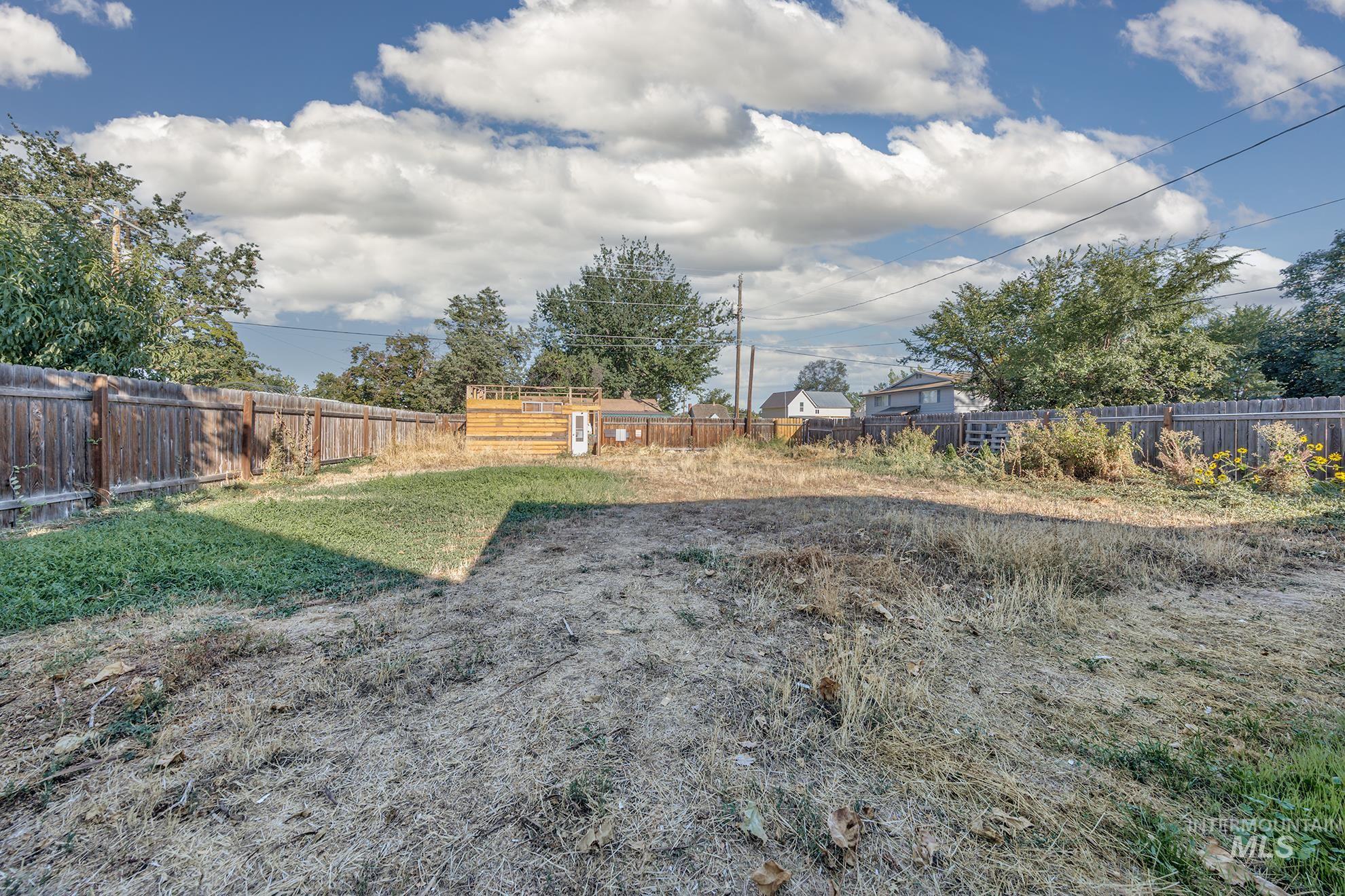 View of fenced backyard