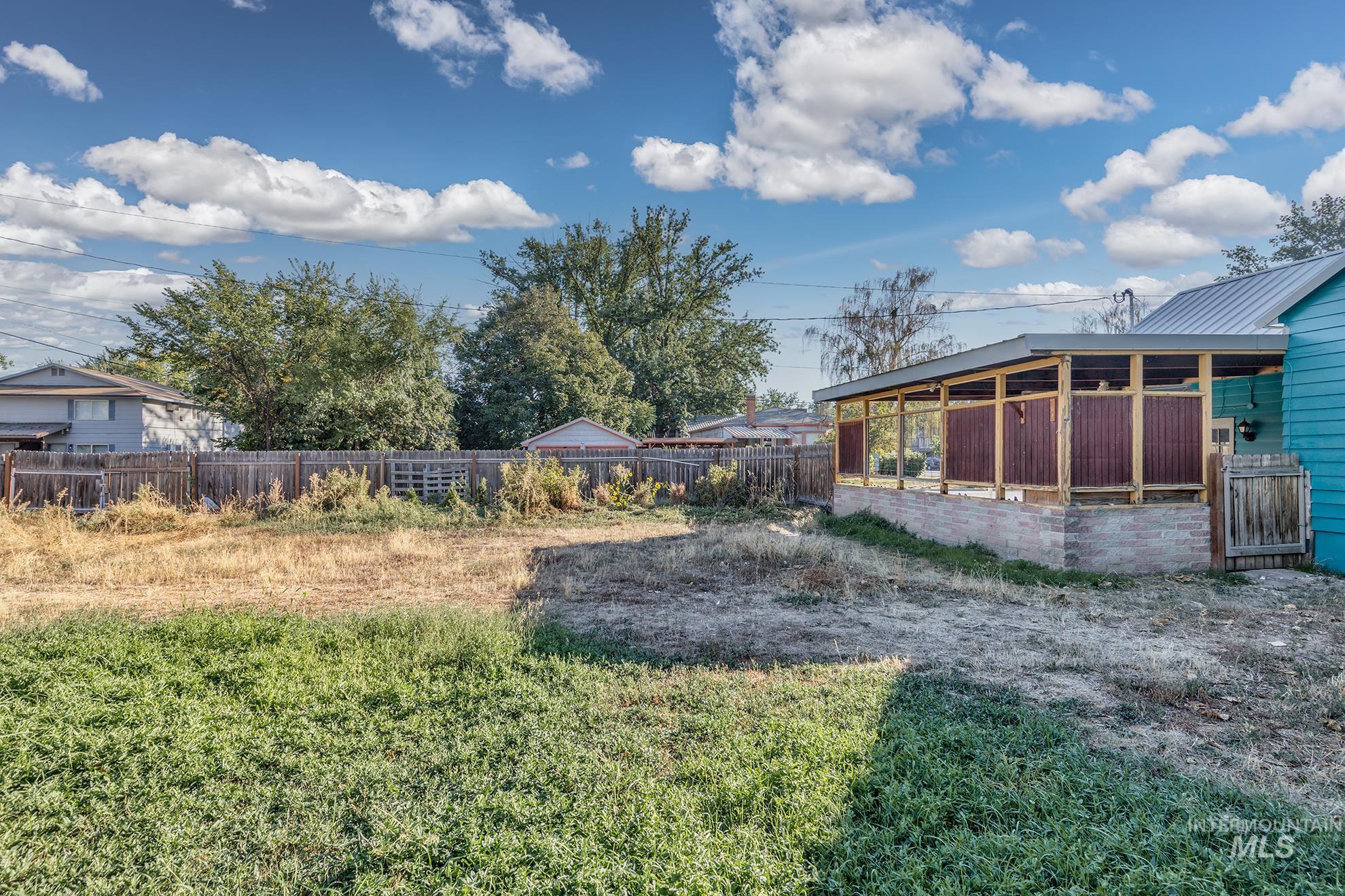 View of yard with a sunroom