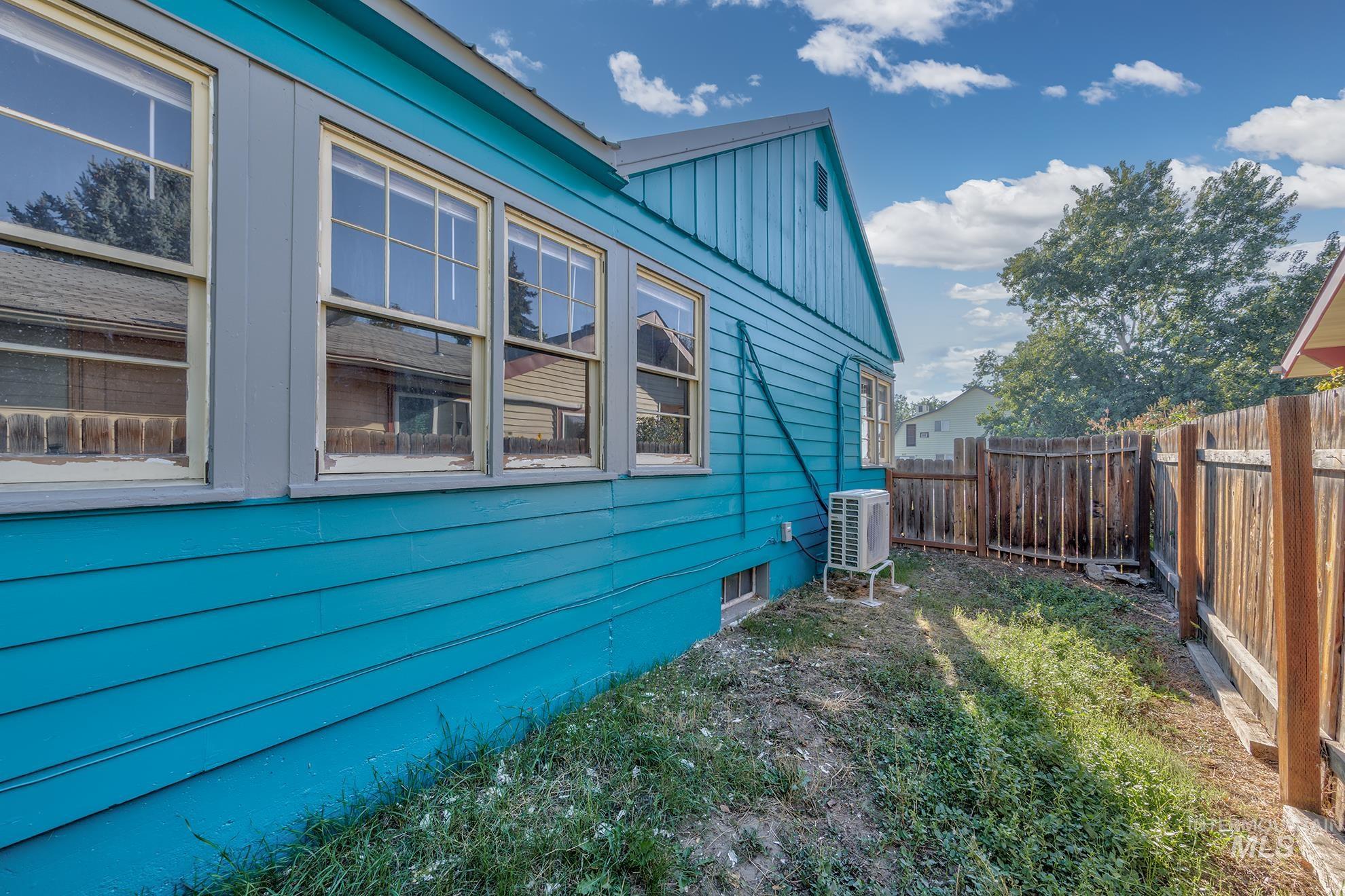 View of home's exterior featuring a cooling unit