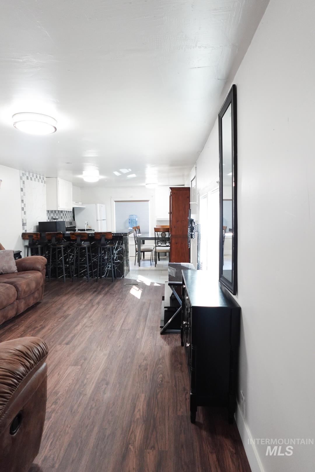 Living area featuring dark wood finished floors
