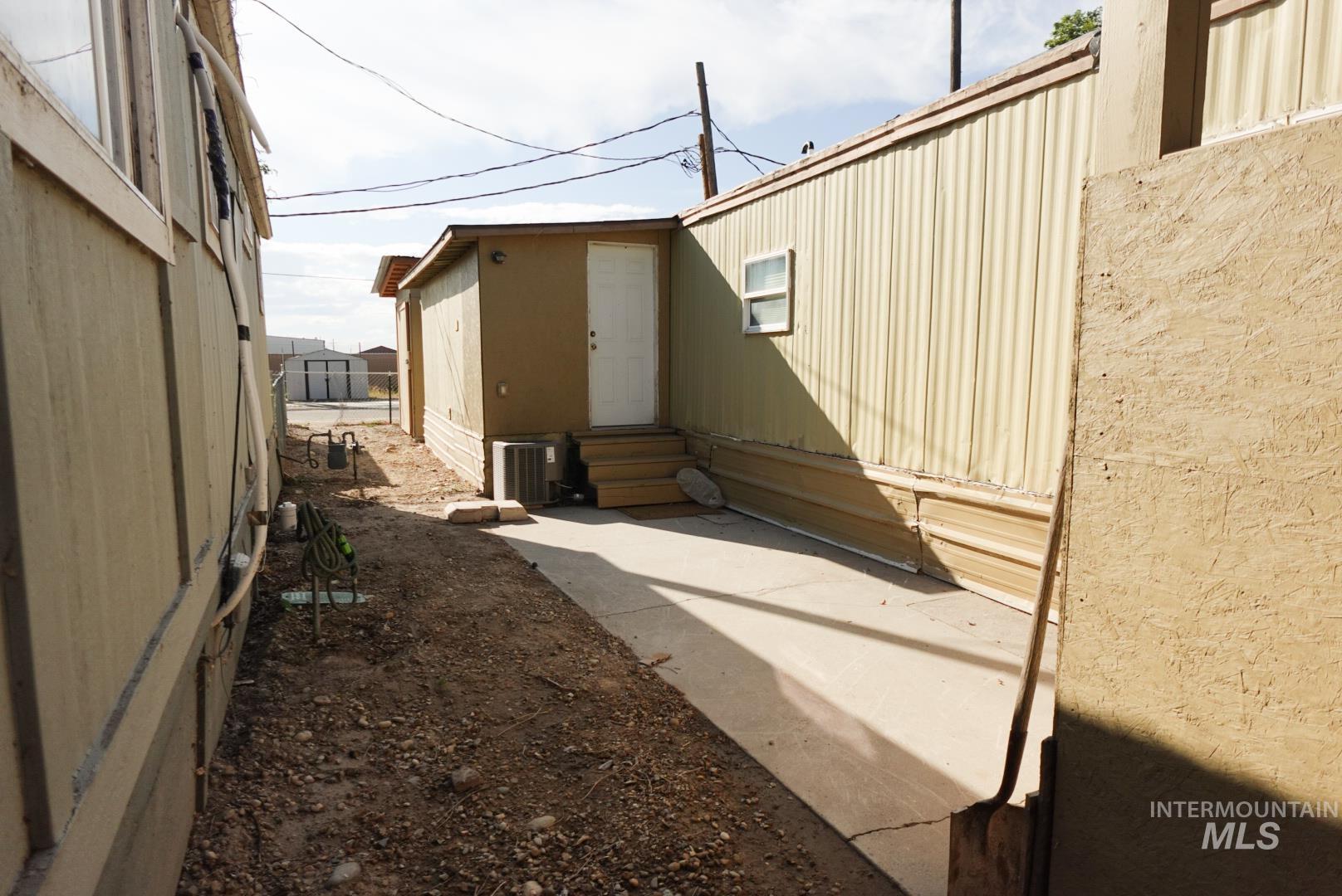 View of side of home with entry steps