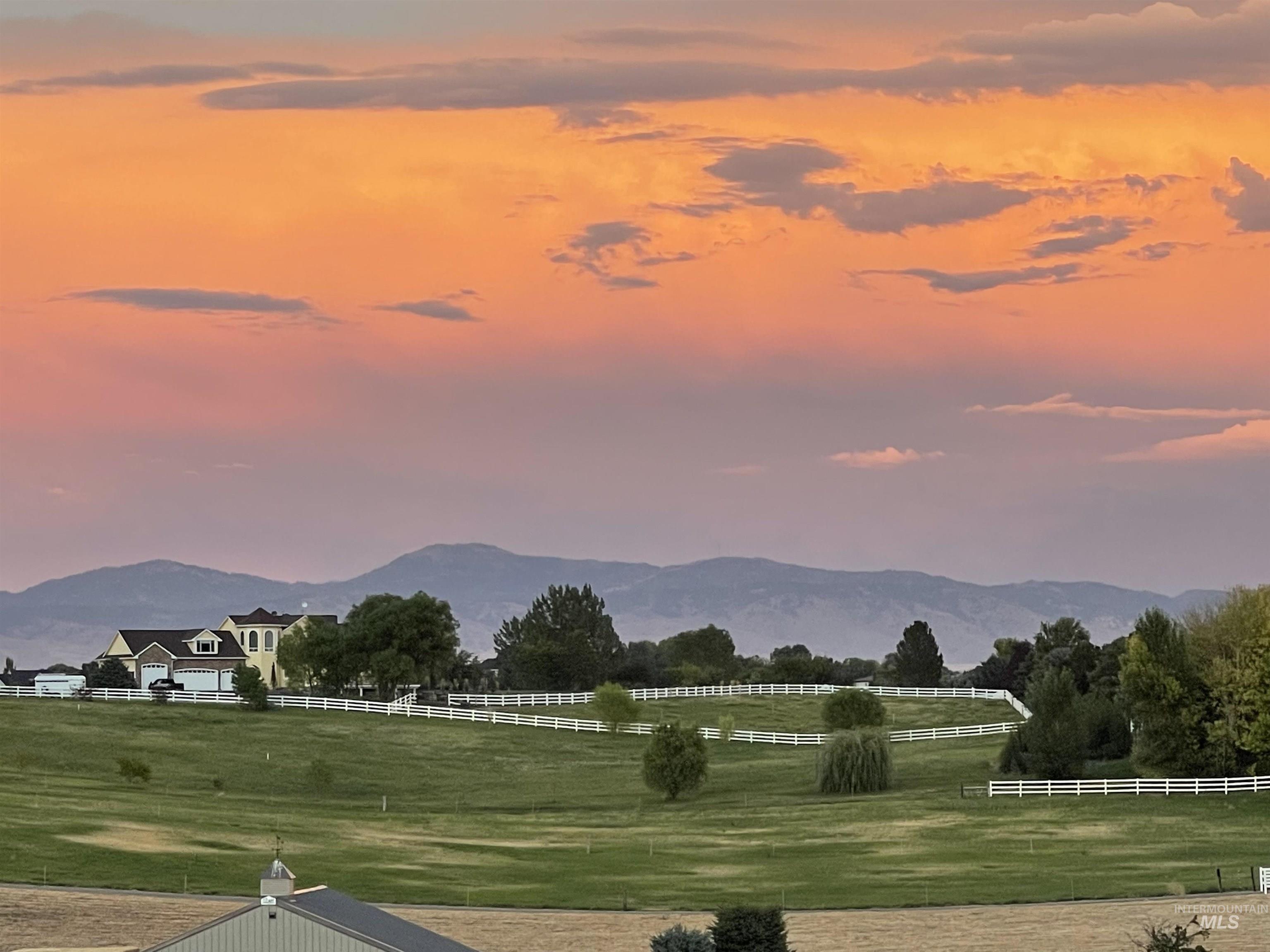 View of mountain background featuring agricultural land and rural landscape